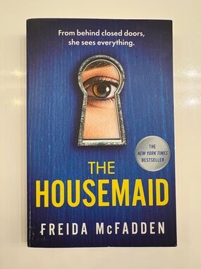 The Housemaid by Freida McFadden - Blue & Yellow Paperback